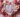 Love month crystals including kunzite, rhodochrosite, ruby and rhodonite for self-love, compassion and romance