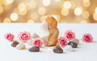 Carnelian flame with agate tumbled stones, roses and fairy lights for grounding, strength and stability
