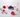 Selenite wand, amethyst, rose quartz and clear quartz with sage bundle and fresh pink roses on white marble — crystal cleansing guide by Heavenly Crystals Online