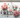 Rose quartz, rhodonite, green aventurine, prehnite and morganite crystals on white marble with soft pink roses — heart healing crystals for attachment wounds by Heavenly Crystals Online