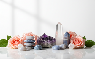 Amethyst, lepidolite, blue lace agate, clear quartz and moonstone crystals on white marble with soft pink roses — supportive crystals for sleep apnoea by Heavenly Crystals Online