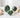 Ruby Zoisite heart, sphere on a gold stand and polished freeform, with green and ruby-pink markings, surrounded by soft pink roses on white marble.