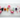 Seven chakra healing crystals including black tourmaline, carnelian, citrine, rose quartz, aquamarine, amethyst and clear quartz on white marble — Heavenly Crystals Online