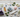 Holiday healing crystals flatlay – Angel Aura Quartz, Citrine, Rose Quartz, Amethyst, Selenite and Blue Lace Agate on white marble with eucalyptus and gold ribbon