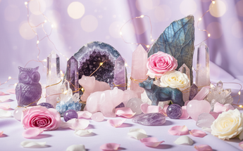 Unique crystal collectables, rare specimens and spiritual treasures arranged with roses and fairy lights