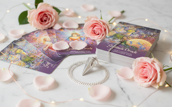 Oracle cards and clear quartz pendulum with pink roses and fairy lights for divination and spiritual guidance