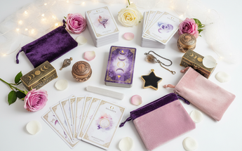 Oracle and tarot cards, pouches and trinket boxes arranged with roses and fairy lights