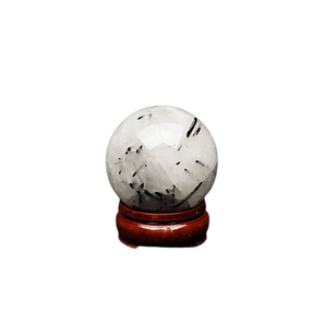 Tourmalinated Quartz Sphere with wooden stand (341g) – Protection, Clarity & Energy Shielding - Heavenly Crystals Online