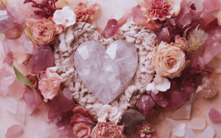 Love month crystals including kunzite, rhodochrosite, ruby and rhodonite for self-love, compassion and romance