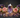Ametrine generator point and tumbled stones with roses and fairy lights for clarity, balance and spiritual growth
