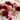 Healing crystals for love and relationships including Rose Quartz, Rhodonite, Moonstone and Garnet on a luxury background