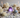 Crystals for sleep including Amethyst, Lepidolite, Moonstone, Howlite and Selenite styled on a luxury bedside setting