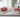 Copper dowsing rods set on white marble surface with soft pink roses, natural light, divination tools from Heavenly Crystals Online