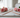 Copper dowsing rods set on white marble surface with soft pink roses, natural light, divination tools from Heavenly Crystals Online