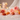 Carnelian, Sunstone and Rose Quartz crystals with pink roses and fairy lights for confidence and self-worth