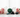 Malachite, clear quartz, shungite, amazonite and obsidian crystals on white marble with soft pink roses — healing crystals for somatic pain support by Heavenly Crystals Online