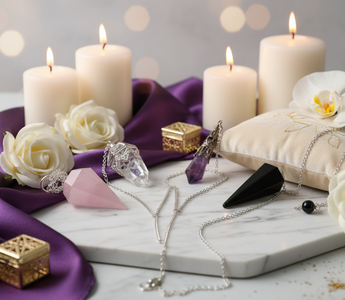 Crystal pendulums for divination and dowsing including Amethyst, Rose Quartz, Clear Quartz and Black Obsidian on a luxury background