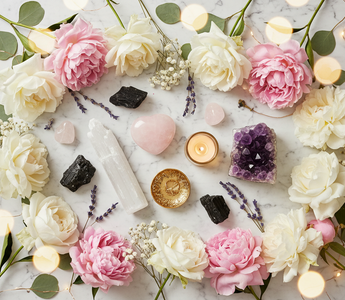 Crystals for healer burnout — selenite, rose quartz heart, amethyst and black tourmaline with pink peonies, white roses and gold candle on marble – Heavenly Crystals Online