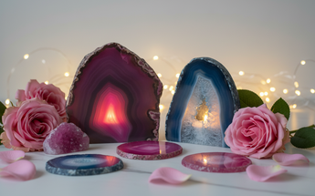 Pink and blue agate cave candle holders with glowing candles, roses and fairy lights for spiritual home decor