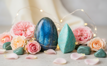 Polished labradorite free form and amazonite flame crystals with pink roses and fairy lights for sculpted energy and healing décor
