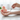 A silver tuning fork is held over a person's wrist and palm - Heavenly Crystals Online