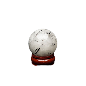 Tourmalinated Quartz Sphere with wooden stand (341g) – Protection, Clarity & Energy Shielding - Heavenly Crystals Online